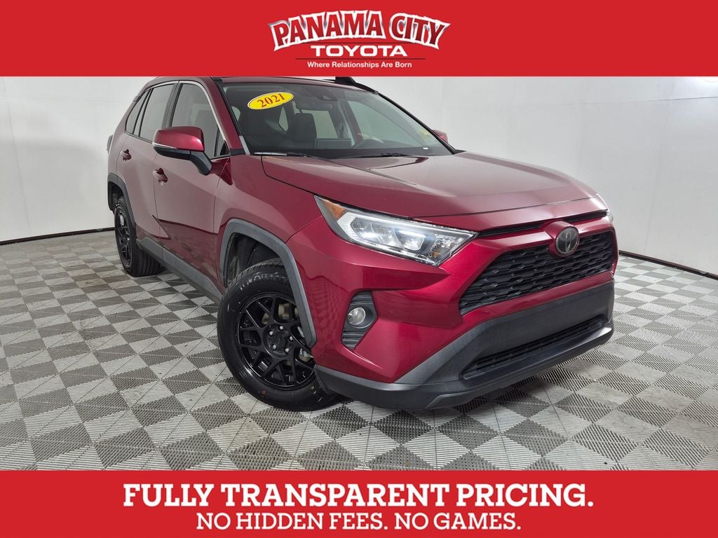 2021 Toyota RAV4 XLE in Ruby Flare Pearl — front three-quarter view